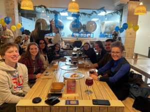 Students and faculty around a table